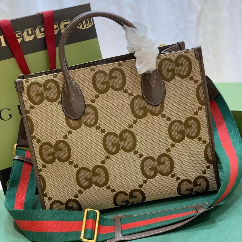 G*u*i shopping bags